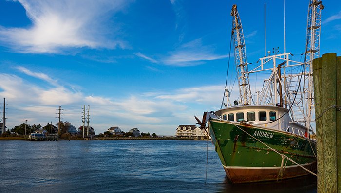 A commercial fishing boat docked in a harbor